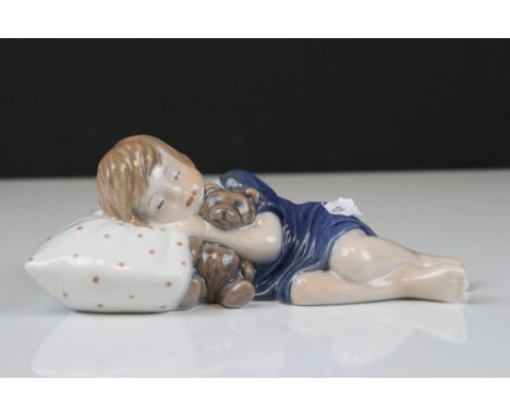 Royal Copenhagen model of a Child sleeping on a pillow, numbered 675, 15.5cms long 