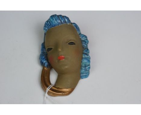 Goldscheider Pottery wall mask, model no.8249, modelled as a Mediterranean woman with blue hair and gold scarf, ink and impre