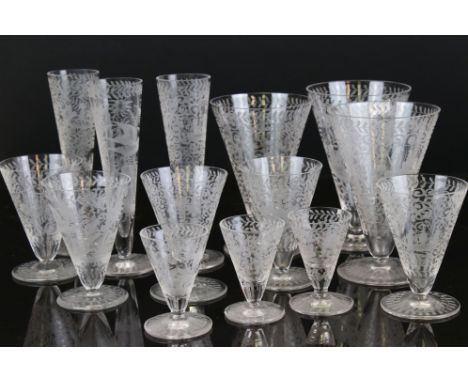 Large matched suite of Early 20th century Drinking Glasses, all with etched scrolling foliate decoration and scenes including