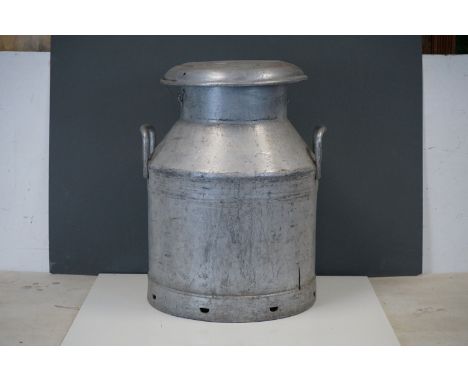 A vintage United Dairies aluminium milk churn. 