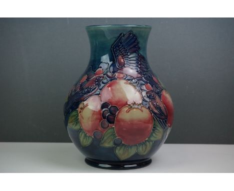 Moorcroft Pottery Vase of baluster form in the Finch and Berry pattern, impressed marks to base, 24cms high 