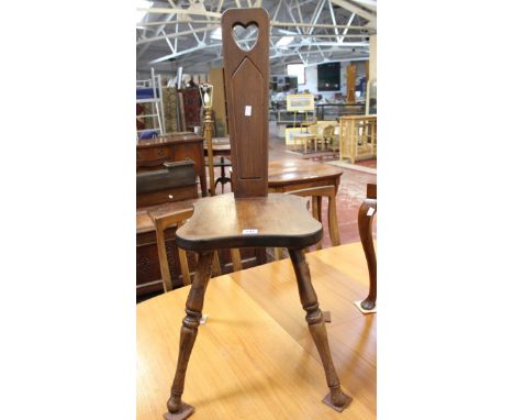 A spinning chair with pierced heart and caned piano stool 