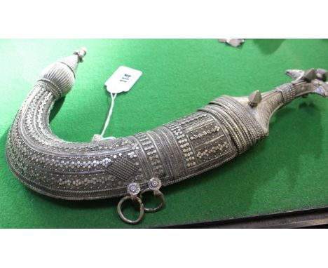 An Omani silver coloured metal Dagger (Khanjar) with sheath