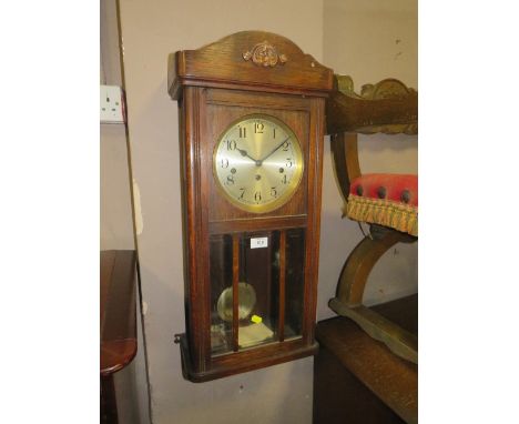 A VINTAGE OAK CASED WALLCLOCK