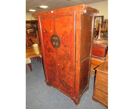 A CHINESE TWO DOOR LACQUERED CUPBOARD WITH RED PAINTED DETAIL H-177 W-107 CM