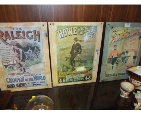 THREE MODERN REPRODUCTION ENAMEL BICYCLE RELATED ADVERTISING SIGNS
