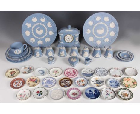 A Wedgwood pale blue Jasperware mantel timepiece, 20th century, in Classical style sprigged with white dancing hours figures,