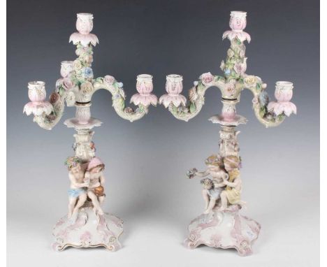 A pair of Meissen style four-light Continental porcelain candelabra representing the Seasons, late 19th/early 20th century, b