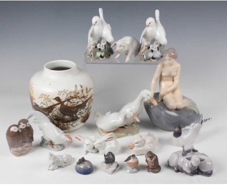 A Royal Copenhagen model of the Little Mermaid, after Edvard Eriksen, model No. 4431, height 21.5cm, together with fifteen ot