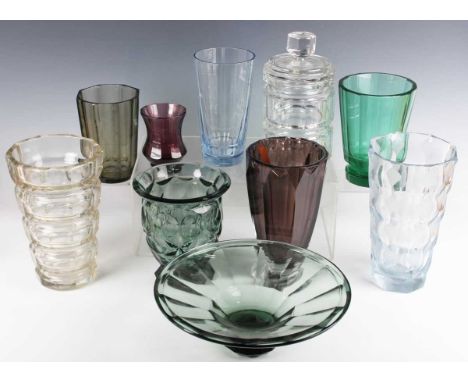 A Moser style Art Deco green tinted glass bowl, first half 20th century, of flared faceted form on a faceted foot, unmarked, 