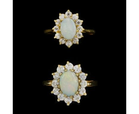 Two 9ct gold opal and cubic zirconia cluster rings, hallmarkedCondition Report:Approx 4.7gm, sizes L-M and M-N, max head = 14