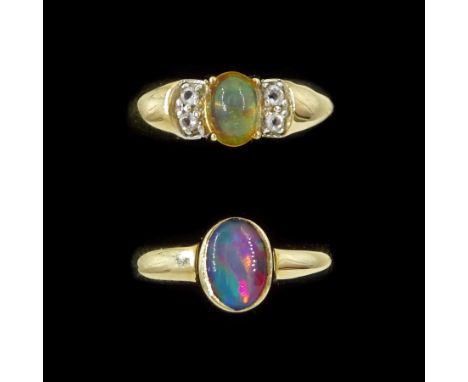 Gold opal triplet ring and a gold opal ring, both hallmarked 9ctCondition Report:Approx 4.95gm, both size N, max depth = 7.4m
