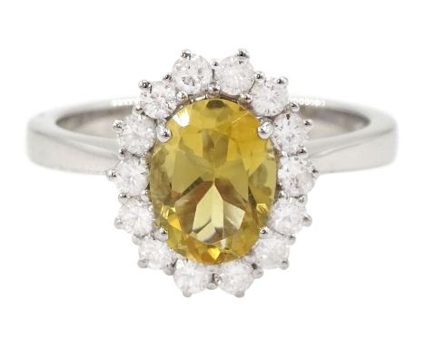 18ct white gold oval cut citrine and round brilliant cut diamond cluster ring, hallmarkedCondition Report:Approx 4.1gm, size 