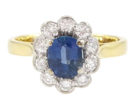 18ct gold oval cut sapphire and round brilliant cut diamond cluster ring, London 1984, sapphire approx 1.00 carat, total diam