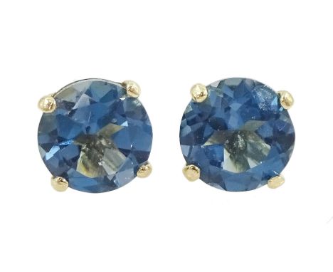 Pair of 9ct gold London blue topaz stud earrings, stampedCondition Report:Approx 0.4gm, diameter = 4.15mm, good condition