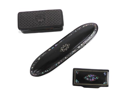 Two Victorian black lacquered papier snuff boxes - one inlaid with silver pique work and mother of pearl, 6.25cm. long, the o