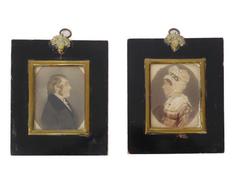 A pair of late-Regency portrait miniatures - watercolour on card within painted ovals, depicting a gentleman and his wife, 7.