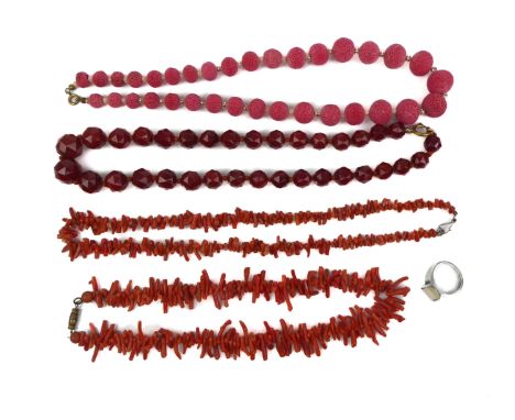 Four vintage necklaces of red coral and carnelian, and a silver ring set with a white stone (5).