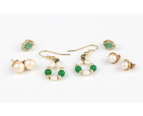 A small collection of 9ct gold earrings - including a pair set with pale emeralds; a pair of rice pearl and chrysoprase hoop 