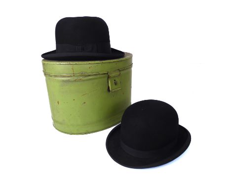 Two vintage bowler hats in a green painted tin hat box - one by G. A. Dunn&nbsp; &amp; Co. Ltd., London, internal measurement