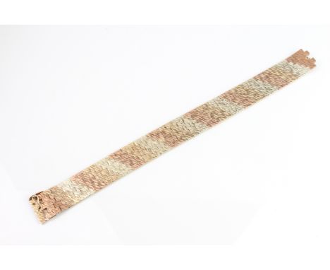 A vintage three-colour 9ct gold articulated link bracelet - hallmarked London 1970, 18.7cm. long, weight 43.9g.