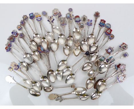 Fifty-seven hallmarked silver and enamel souvenir teaspoons