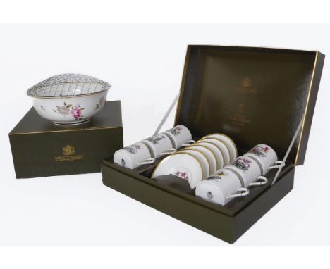 A boxed set of six Royal Worcester bone china coffee cans and saucers, together with a boxed Royal Worcester bone china limit