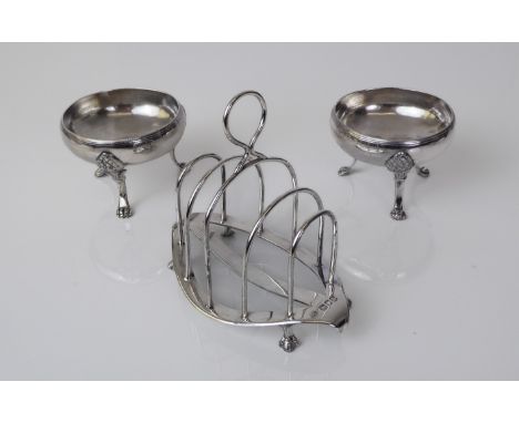 A pair of French silver open salts - late 19th / early 20th century, circular form with rope edged rim, raised on three pinea