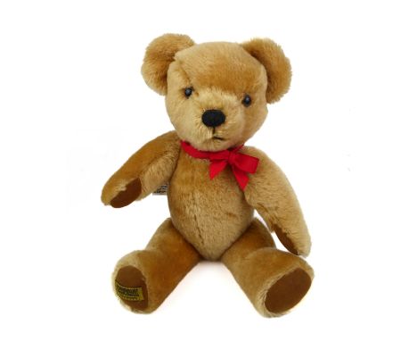 A vintage Merrythought teddy bear.