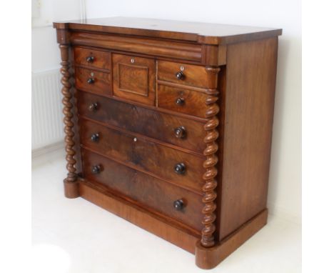 A Victorian mahogany Scottish-style chest of drawers: the full-width ogee top drawer over two short drawers to the left and a