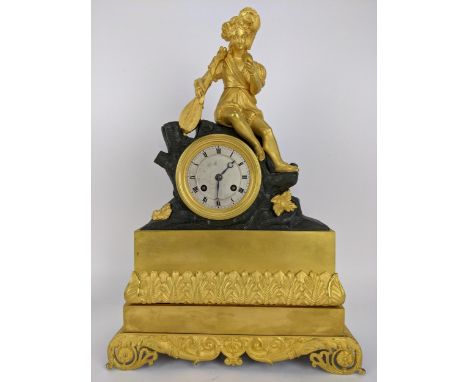 A late 19th century French Louis XVI style gilt metal mantle clock in a classic gilt metal case with acanthus leaf decoration