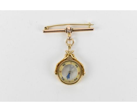 A 9ct yellow gold mounted compass on brooch, fully hallmarked, stamped 375, the bar brooch in rose 9ct gold, total weight 12.