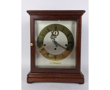 A mid/late 20th century Kieninger mahogany mantle clock, the silvered dial having brass chapter ring with Roman numerals and 