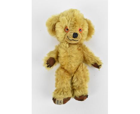 A small Merrythought 'Cheeky' teddy bear, late 1950s, with golden artificial plush, orange and black plastic eyes, inset velv