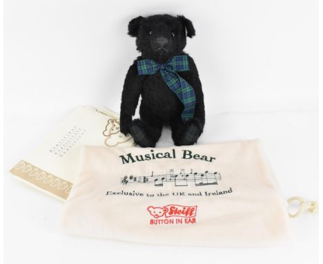 A limited edition Steiff musical bear: 'The Black Watch', no. 608 out of 2,000, with hump back, black mohair and Highland reg