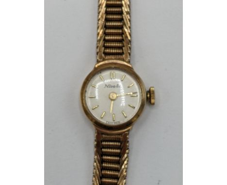 A Nivada manual wind ladies 9ct wristwatch, having a white enamel dial with baton markers, the 17 jewels movement signed Niva