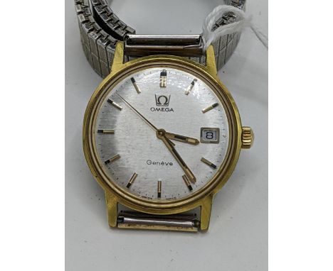 An Omega Geneve, manual winding gents gold plated wristwatch, having a silvered dial with centre seconds and baton hour marke