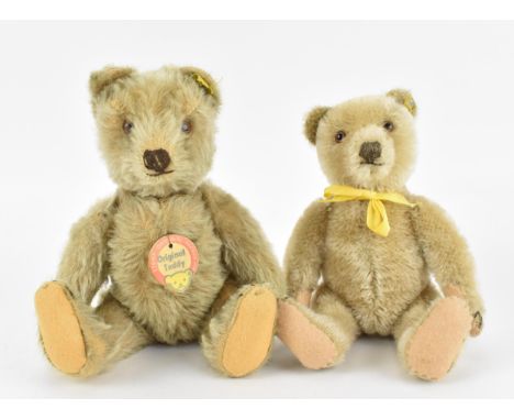 Two post war Steiff teddy bears, one in light mohair, the other in synthetic hair with hump back, both with stitched nose, br