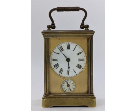 A 19th century French brass miniature carriage alarm clock, the white enamel dial having black Roman numerals above an alarm 