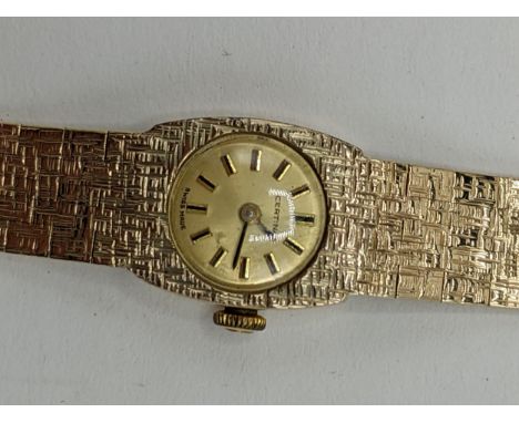 A Certina manual wind ladies 9ct wristwatch, having a gilt dial with baton markers, the 17 jewels movement signed Certina 13-