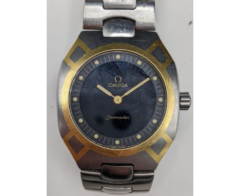 A Omega Seamaster, quartz, gents stainless steel wristwatch, having a black dial with luminous dot markers and hands, Omega c