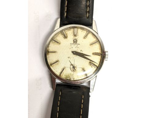 An Omega, manual winding gents stainless steel wristwatch, having a textured dial with subsidiary seconds dial and baton hour