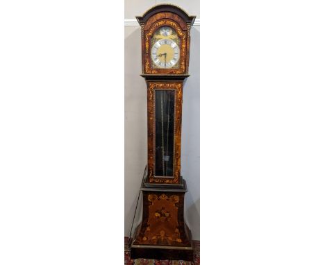 A reproduction burr yew longcase clock, the arched top case having applied gilt metal mounts, pierced grilles and marquetry f