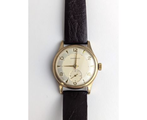 A Garrard gents 9ct gold cased manual wind wristwatch, having a silvered dial with Arabic numerals, subsidiary seconds and gi
