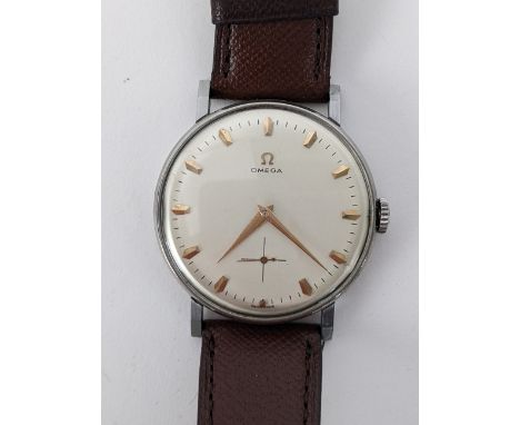 A Omega manual wind gents wristwatch, circa 1958, having a white enamel dial with gilt applied hour markers and subsidiary se