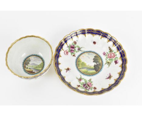 A first period Worcester porcelain teacup and saucer, circa 1778-80, in the Dalhousie pattern, decorated with a central carto