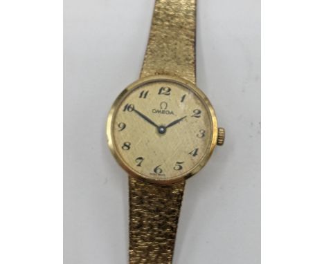 A Omega manual wind ladies 14ct gold wristwatch, circa 1973, having a gilt dial with Arabic numerals, the movement numbered 3