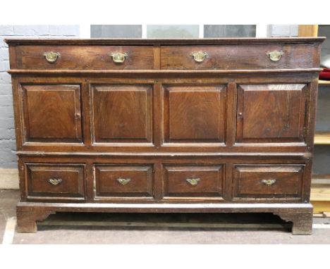 A mid 18th century oak North Country mule chest, altered, of panelled, raised and fielded construction, the rectangular top a