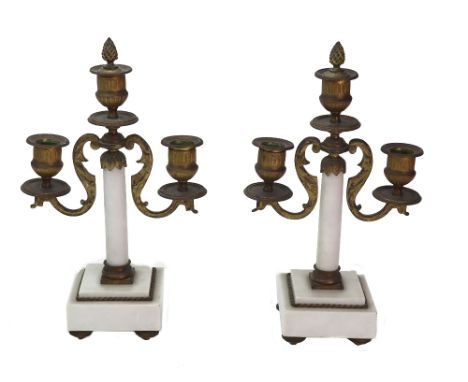 A pair of French gilt metal mounted white marble three light candelabra, late 19th century, the cylindrical columns issuing t
