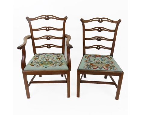 A set of eight 'Chippendale Revival' mahogany dining chairs, circa 1900, the pierced wavy ladder backs, carved with leaf scro